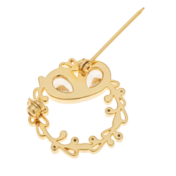 Broche en plaqué or et oxydes de zirconium, rond
